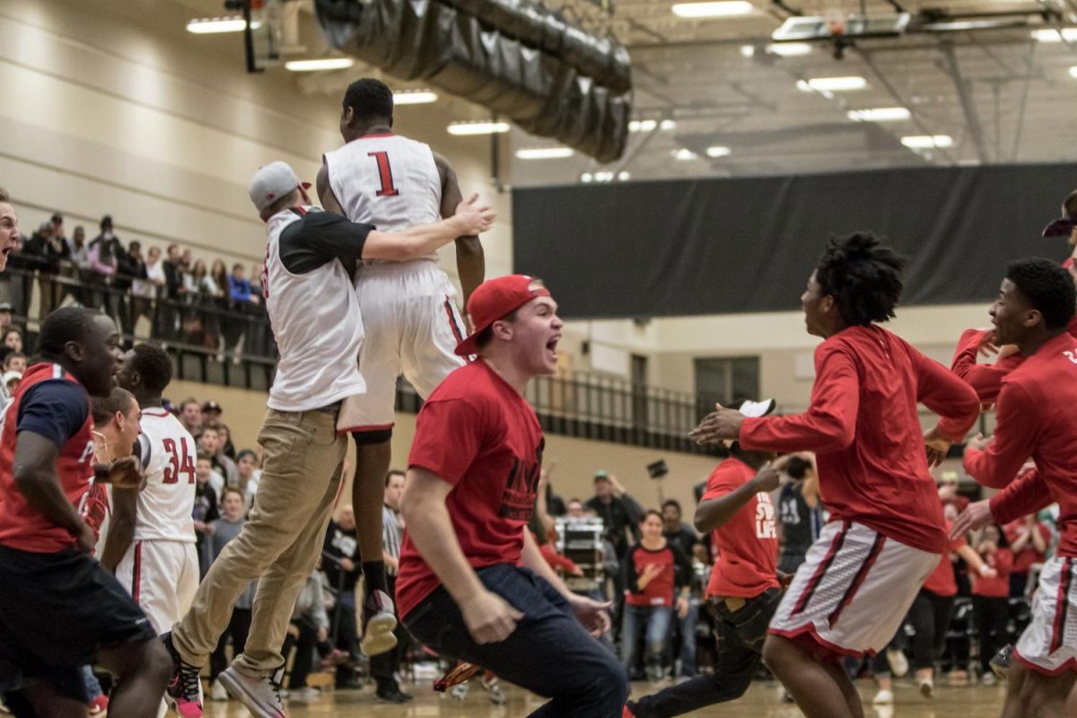 Featured+is+a+photo+from+2+years+ago+of+the+North+St.+Paul+Boys+Basketball+Team+celebrating+their+win+to+make+it+to+State+for+the+first+time+in+decades%21