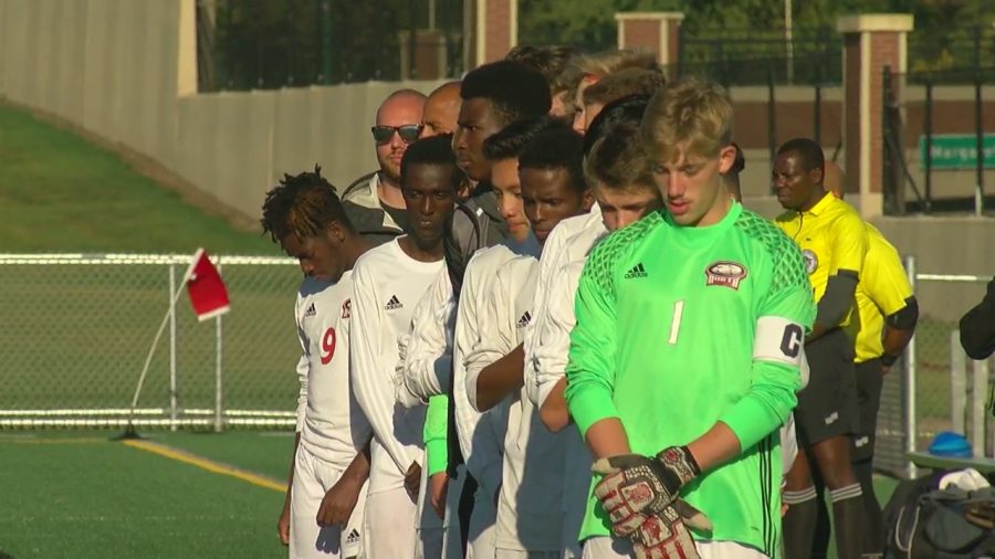 North St. Paul boys varsity soccer team line up for the national anthem 