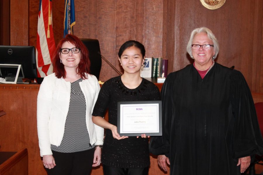 Julia Truong is honored by two Ramsey County judges: left, Judge Jessica Palmer-Denig of the Office of Administrative Hearings; right, retired Ramsey County District Judge Diane Alshouse. (photo: J. Simms)